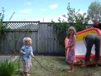 Children with a hosepipe